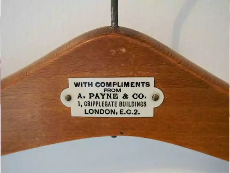 Custom wooden hanger with metal tag